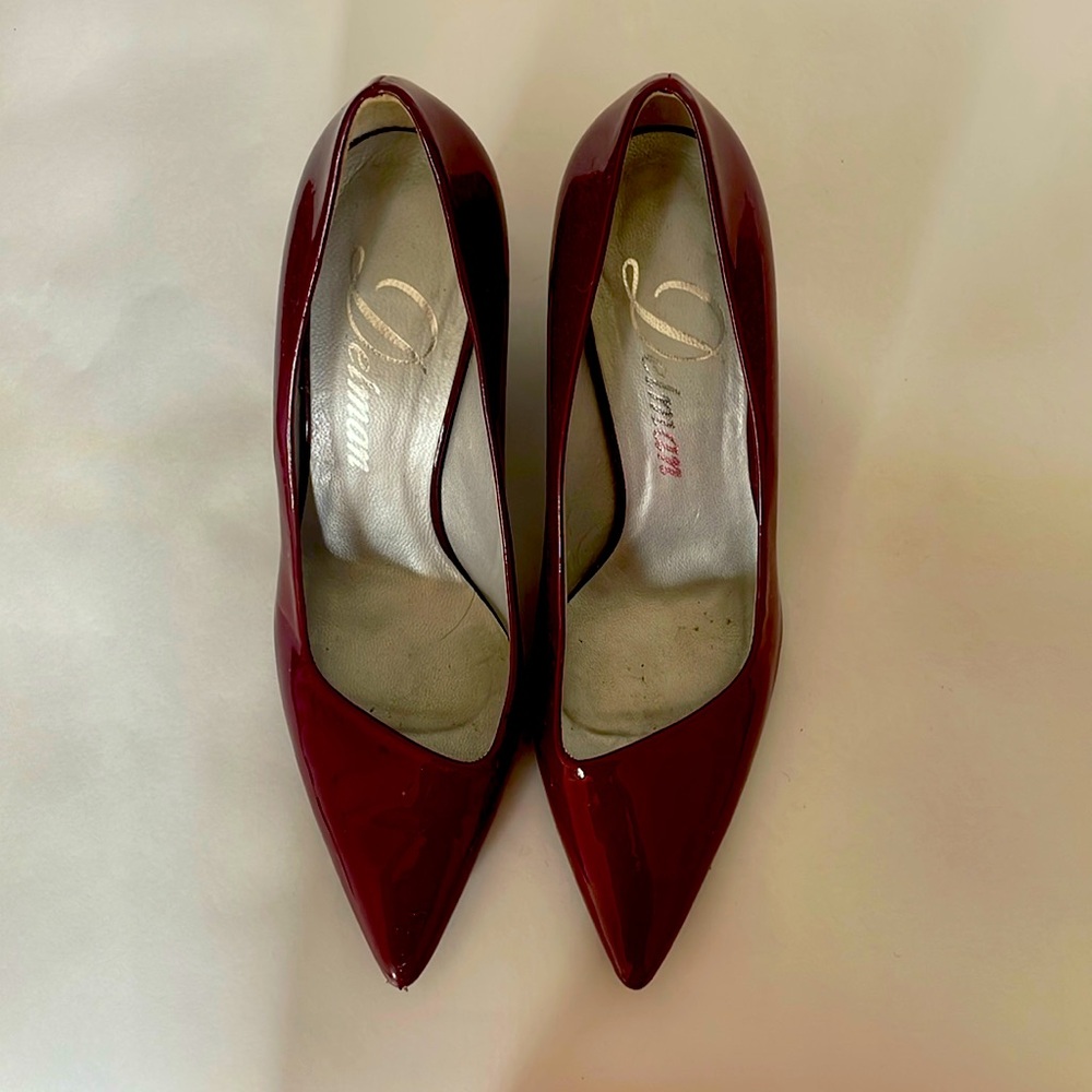 Delman red pumps